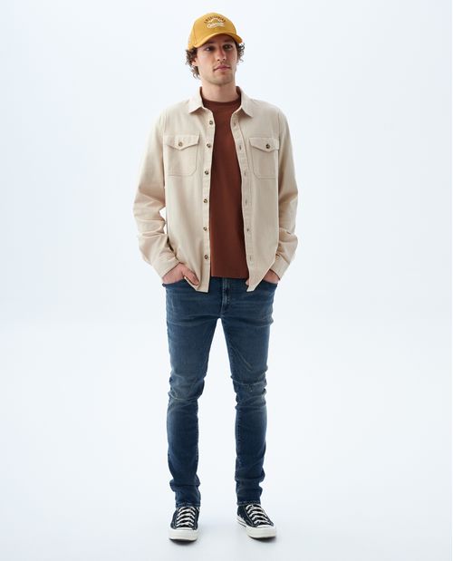 Jean Tapered  tono medio con tallones para hombre