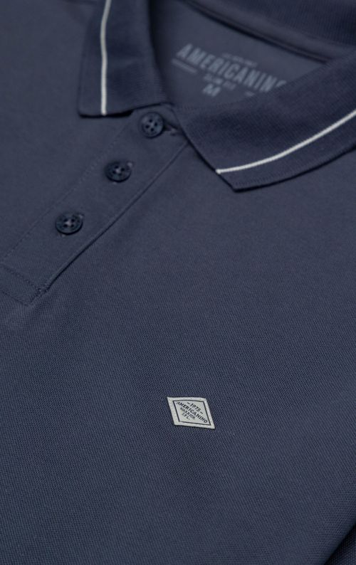Polo con aplique en punto corazón para hombre